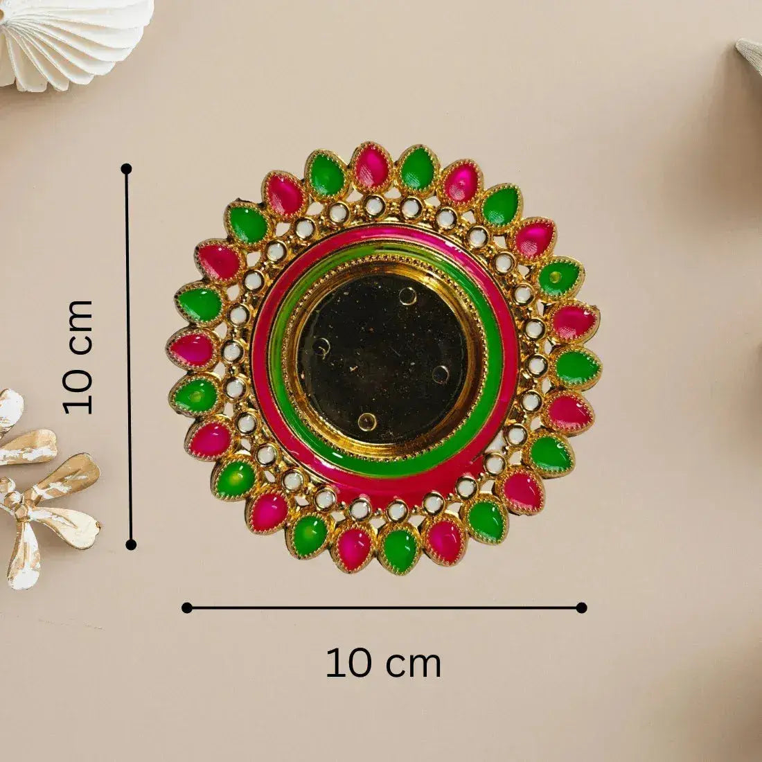 Decorative circular piece with green and pink accents, shown with measurements on a beige background.