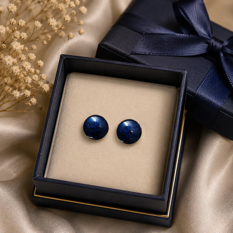 Handmade navy blue glossy resin stud earrings displayed in a luxury navy blue gift box with satin ribbon and premium jewellery styling