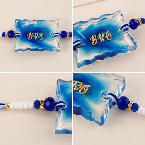 Blue and white marbled rakhis with 'BRO' text on a light background