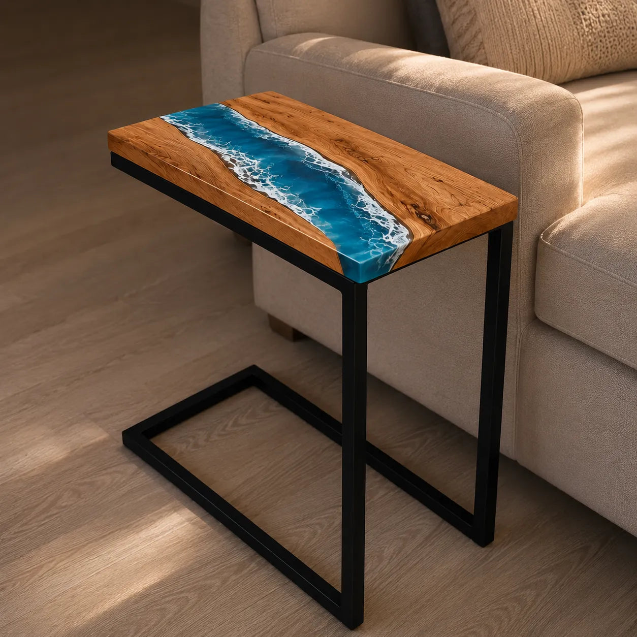Wooden side table with blue resin design next to a beige sofa.