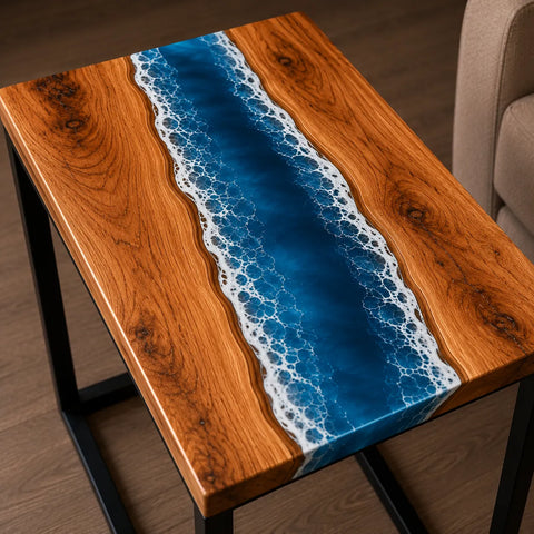 Wooden table with a blue resin river design on a wooden floor.