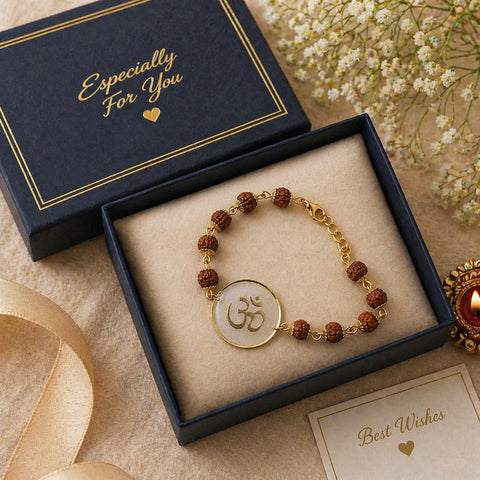 Gold bracelet with a circular emblem in a 'Especially For You' box with flowers in the background