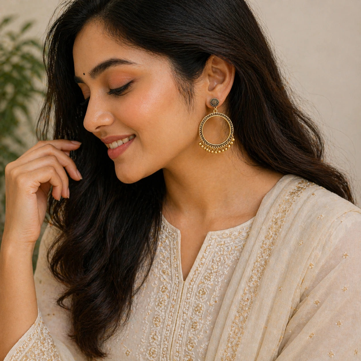 Woman wearing round hoop jhumka earrings with bead detailing ethnic jewellery lifestyle image