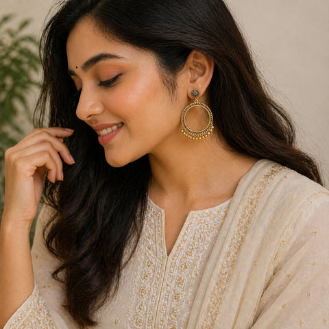 Woman wearing round hoop jhumka earrings with bead detailing ethnic jewellery lifestyle image