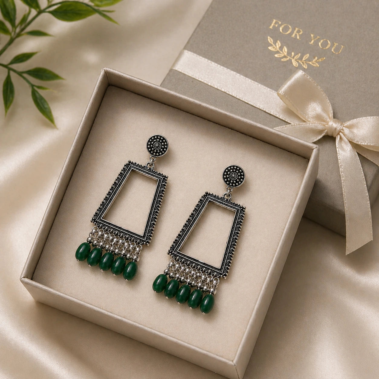 oxidised silver trapezium mirror drop earrings with green beads in gift box premium jewellery packaging image