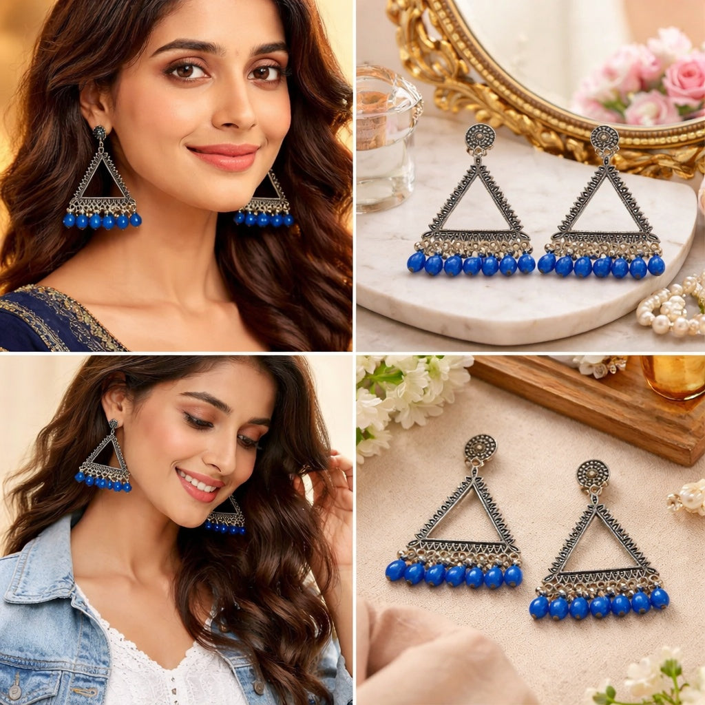 Triangular earrings with blue beads on a model and a decorative surface.