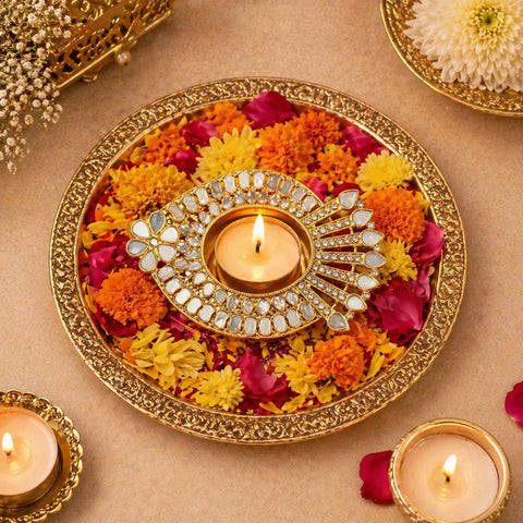 Decorative plate with flowers and candles on a beige background
