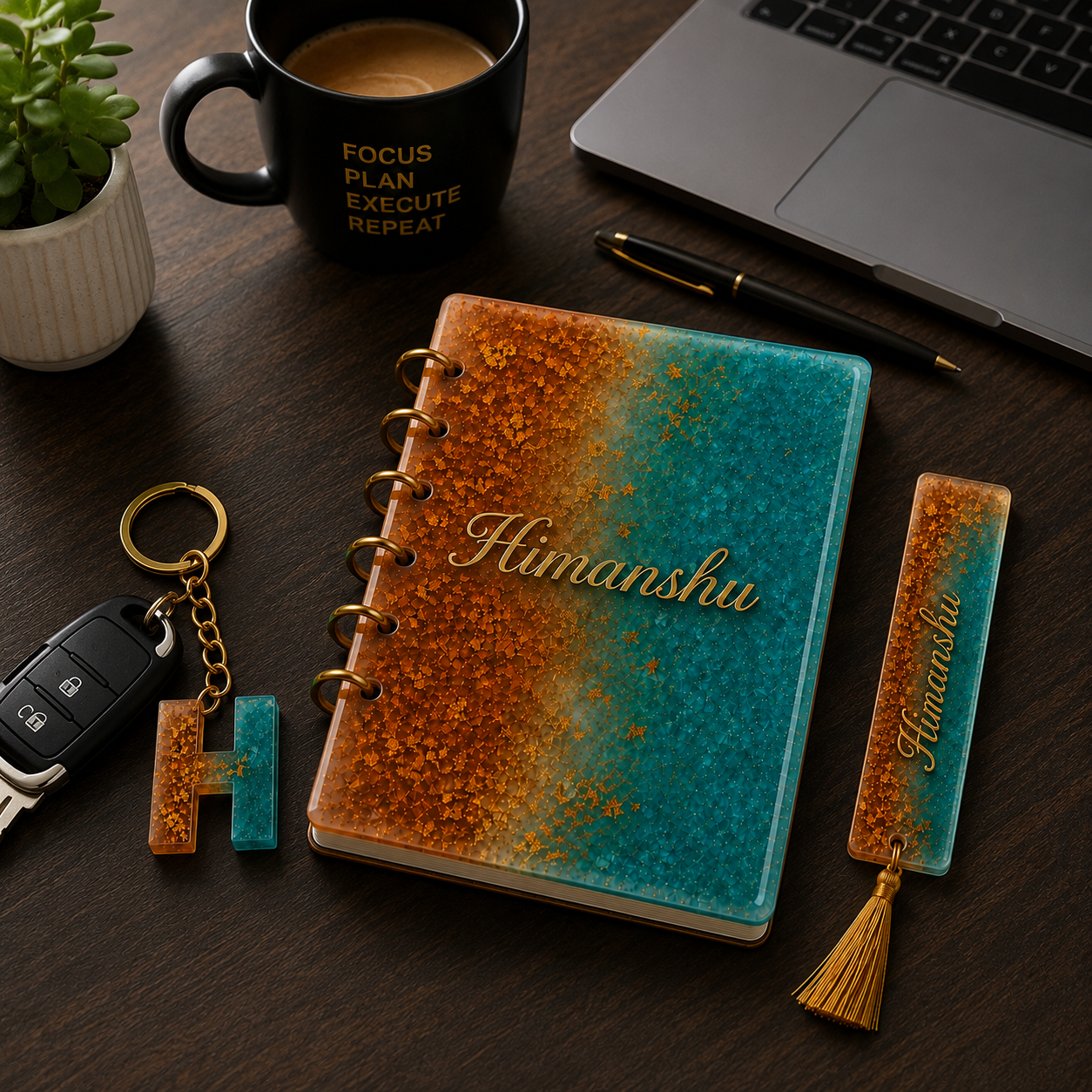 Notebook with 'Himanshu' on a desk with a mug, laptop, and keychain.