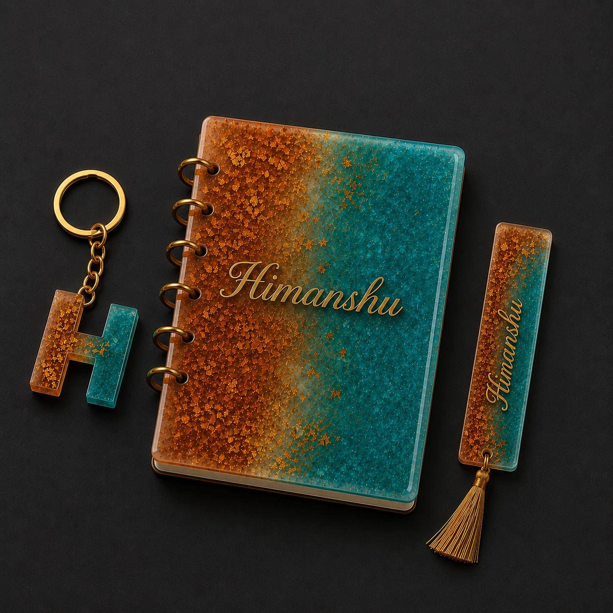 Notebook, keychain, and bookmark with 'Himanshu' branding on a dark background
