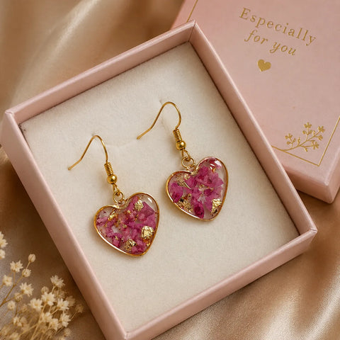 Pink floral heart resin drop earrings with gold flakes presented in a premium gift jewellery box with elegant feminine gifting setup