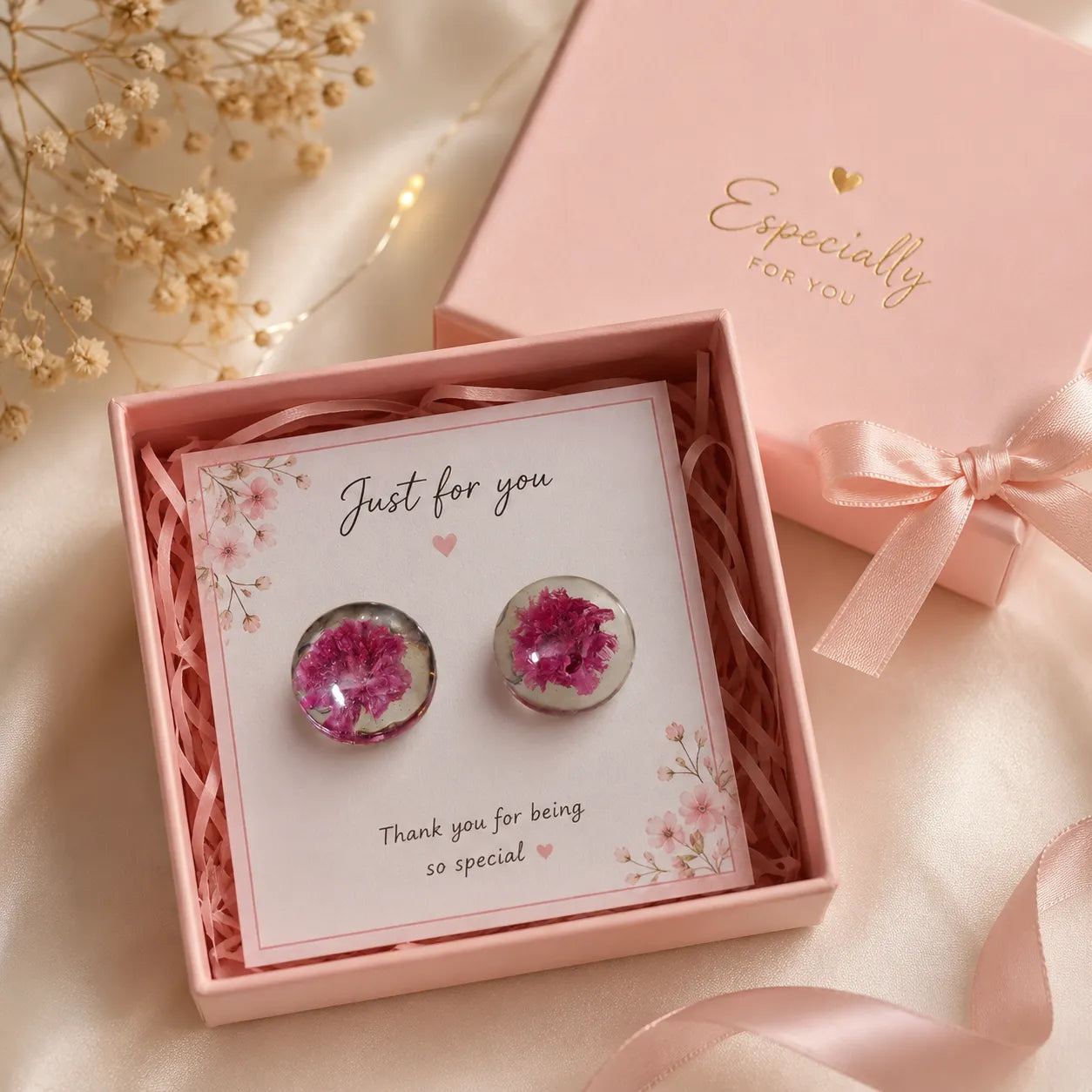 Handmade pink floral resin stud earrings displayed in a pink luxury gift box with ribbon and premium handmade jewellery packaging
