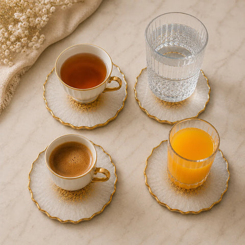 Café and juice set on marble surface with decorative coasters