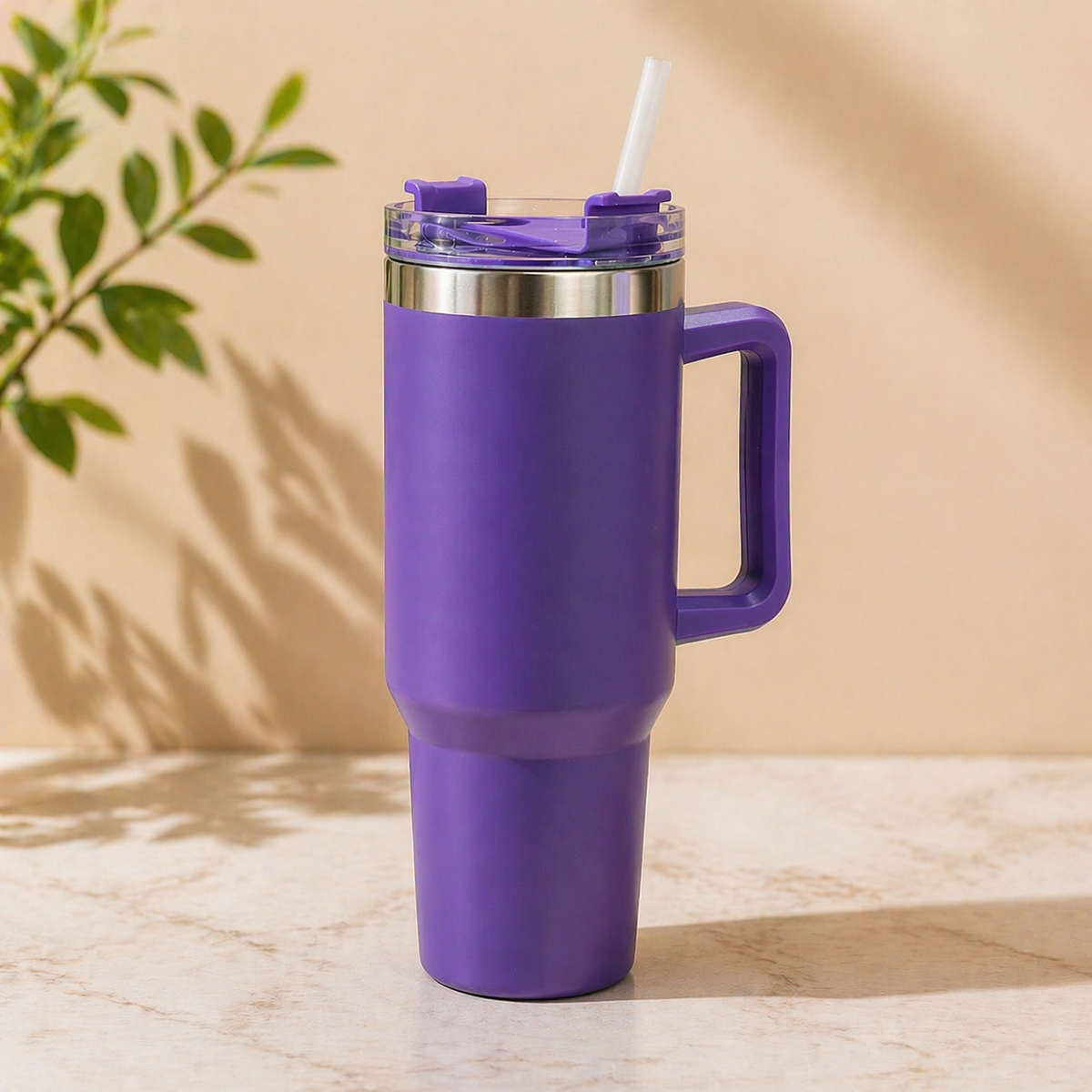 Purple stainless steel insulated tumbler with handle and straw, 1200ml large capacity travel mug for hot and cold drinks on marble surface