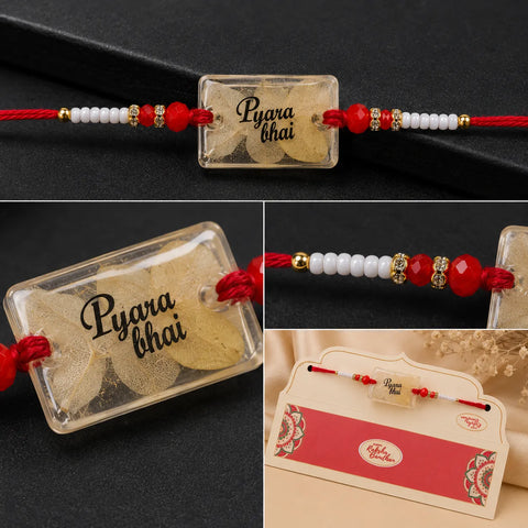Rakhi with 'Pyara Bhai' card on a dark background