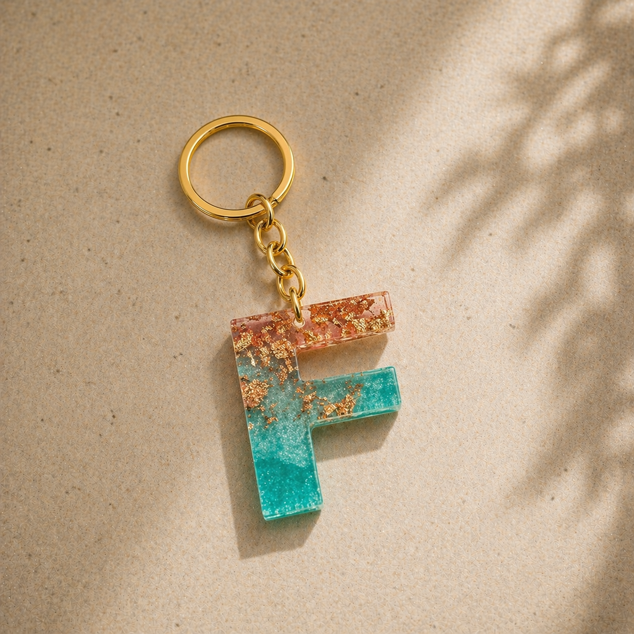 Keychain with a letter 'F' design on a beige background