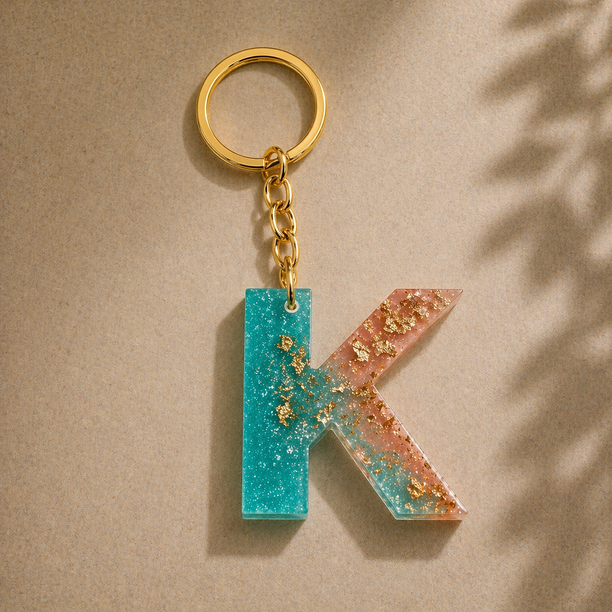 Keychain with a letter 'K' design on a beige background