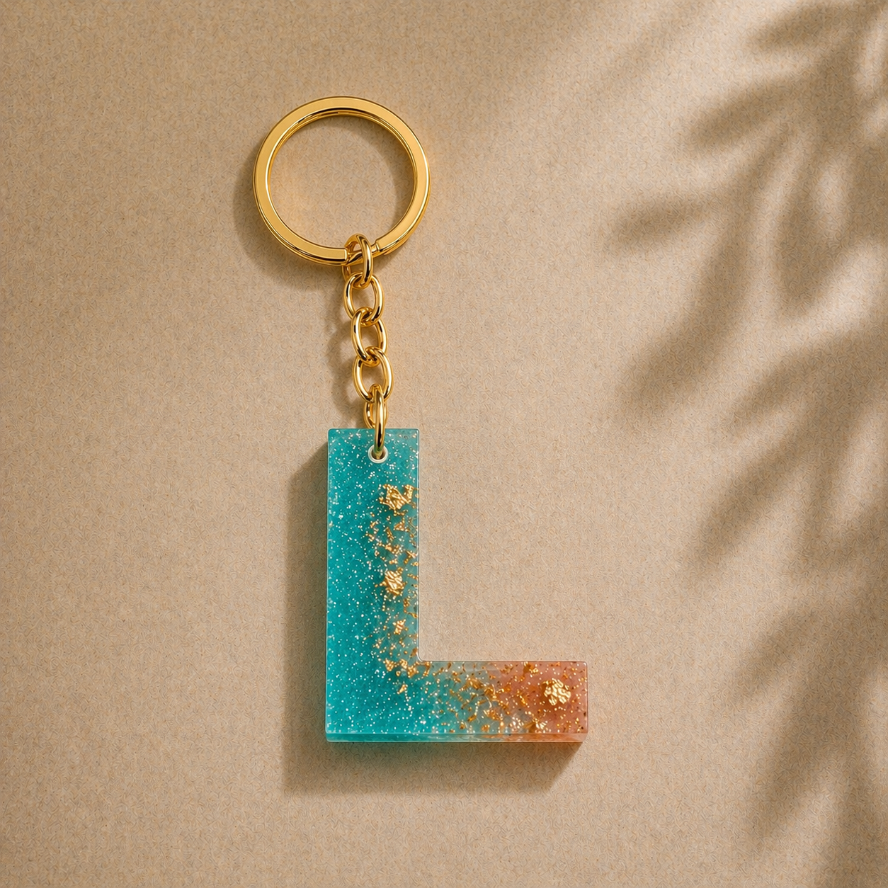 Keychain with a blue and orange rectangular pendant on a beige background