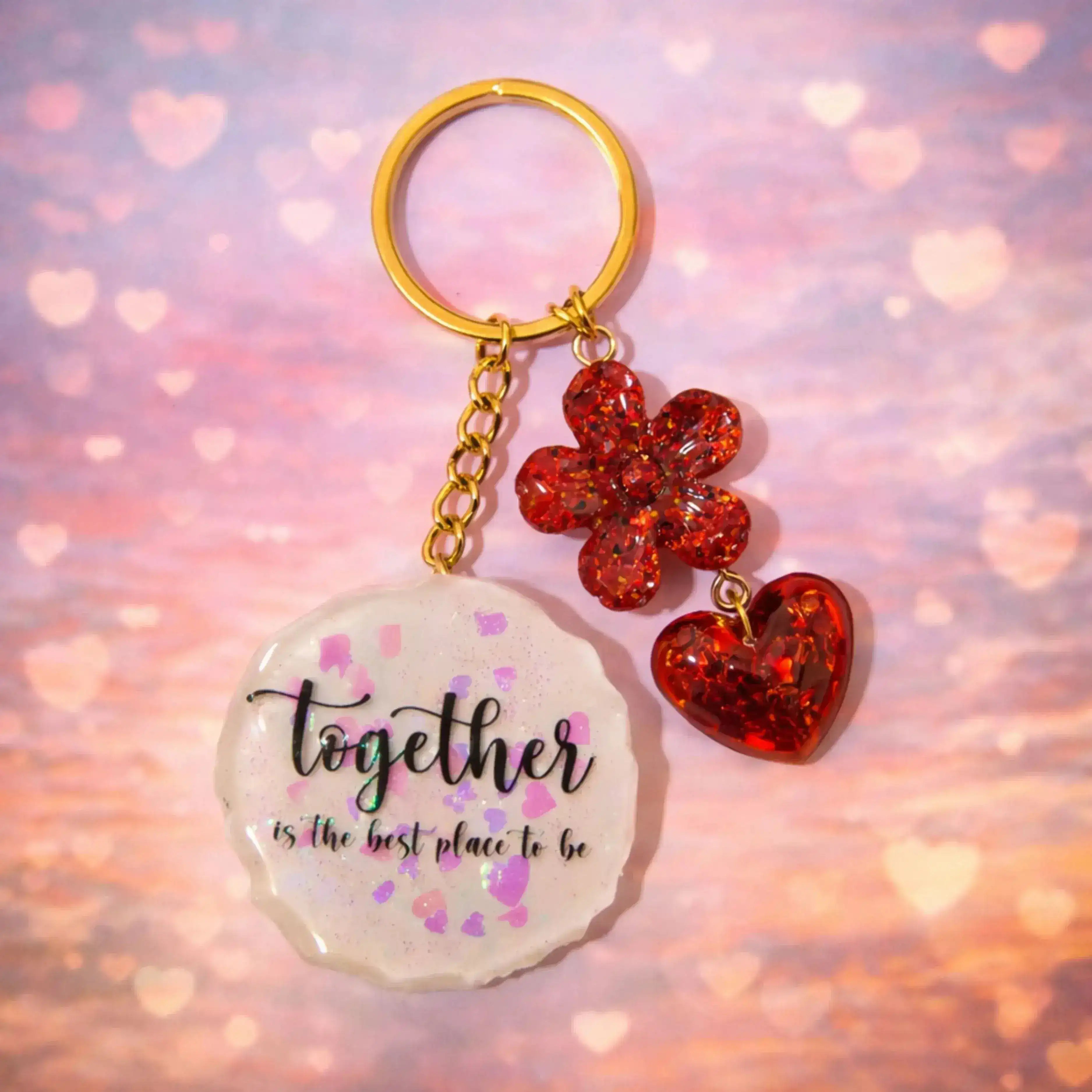 Resin couple keychain with “Together is the best place to be” text, red glitter heart and flower charms, romantic gift for partners and loved ones