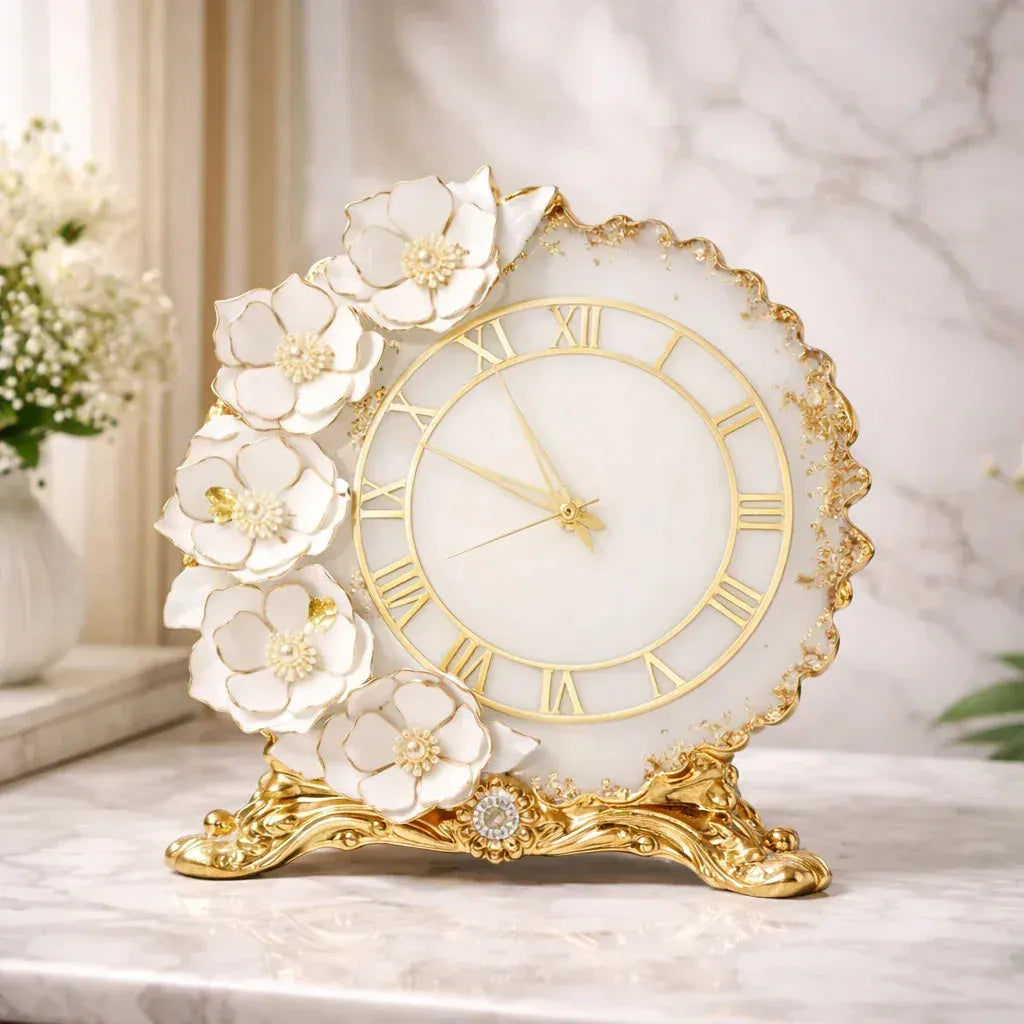 Decorative clock with floral design on a marble surface